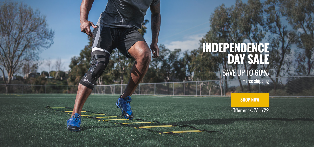 Independence Day Sale - Save up to 60% - athlete wearing knee support running drills