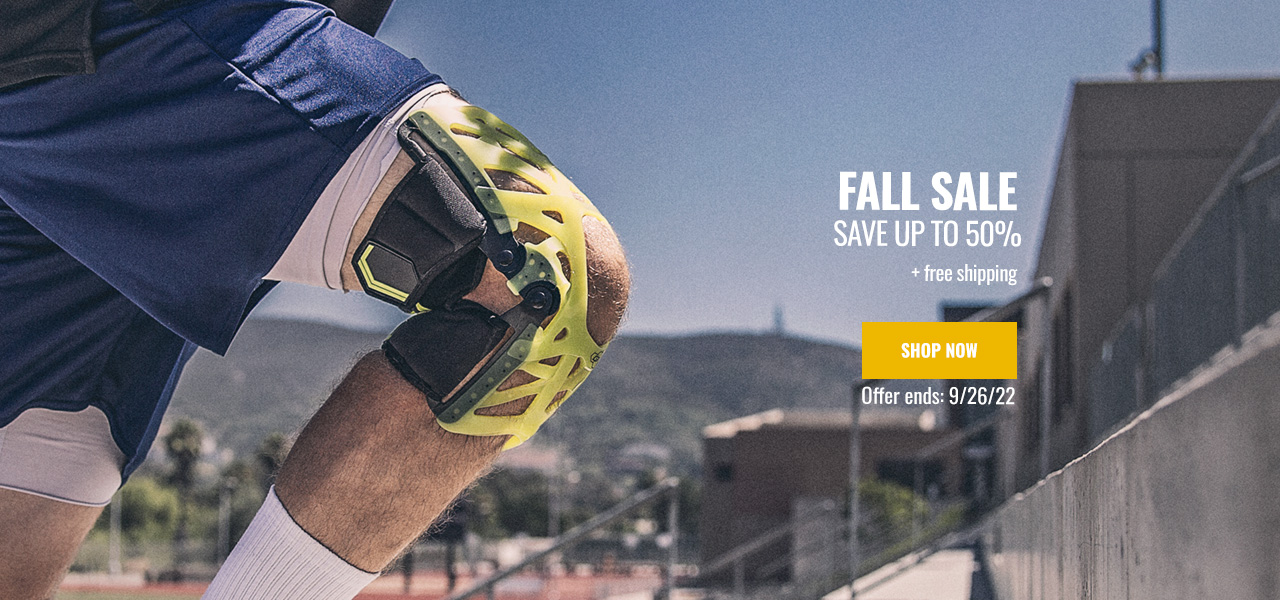 Fall is Here - Save up to 50% - athlete wearing knee brace running stadiums